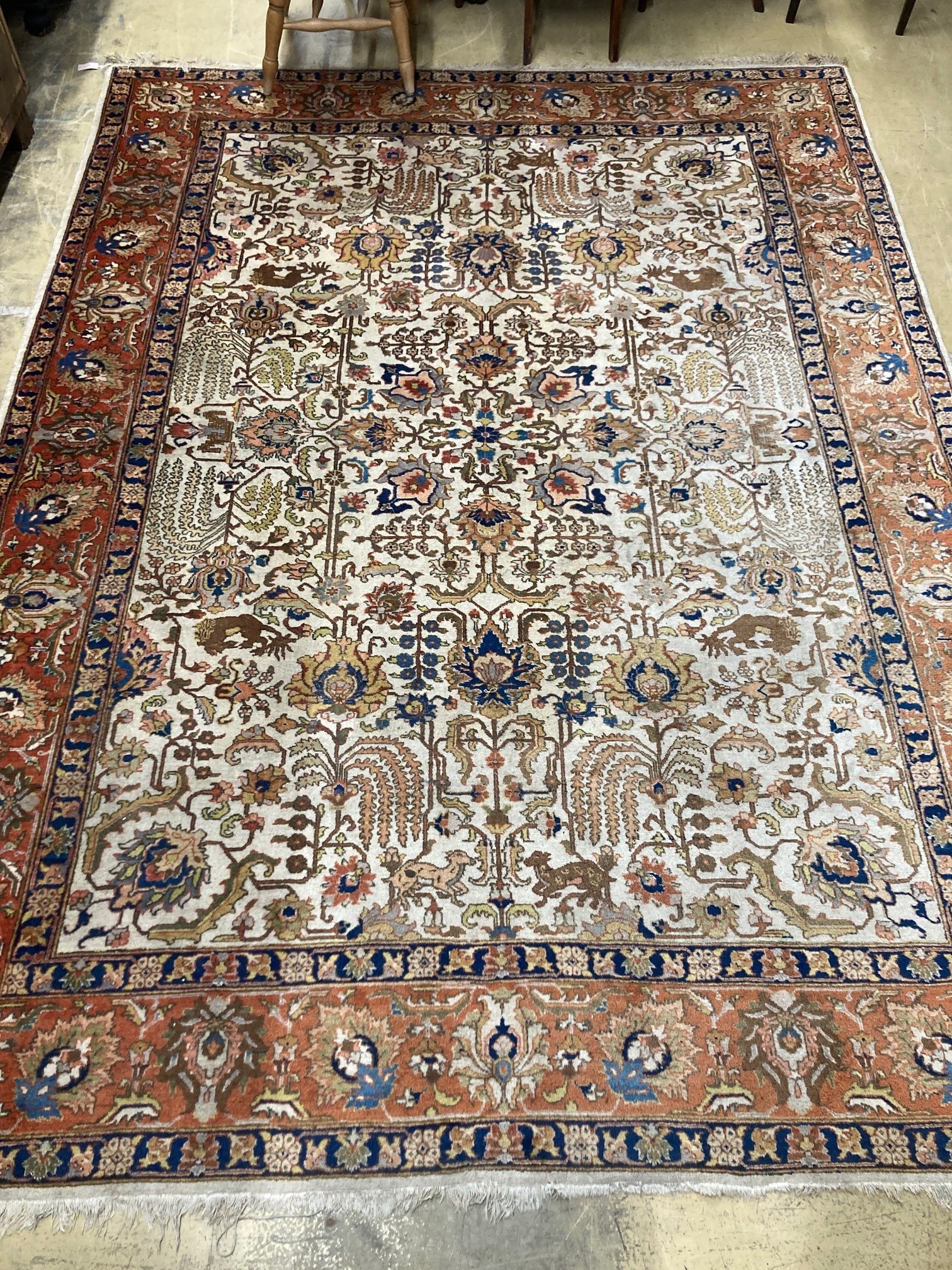 A modern Persian ivory ground rug, 340 x 260cm